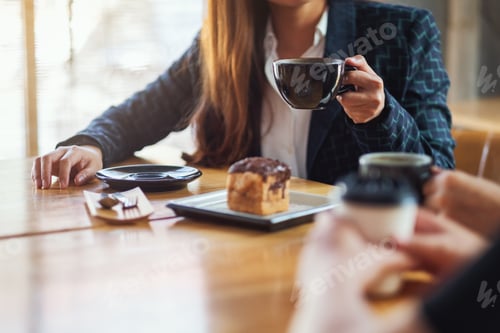 Preview: Closeup image of people enjoyed talking, eating and drinking coffee together in cafe
