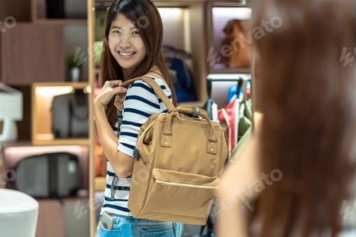 Preview: Happy Asian woman choosing the women bag store shop with happy action at department center