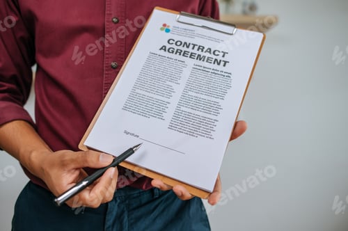 Preview: Male employee presenting work with documents