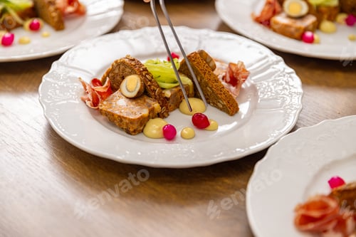 Preview: Chef are arranging small pieces of food