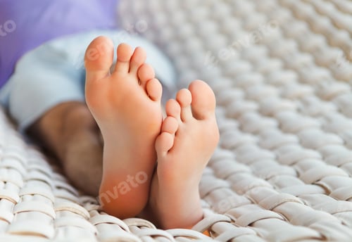Preview: Feets in a hammock on a summer day
