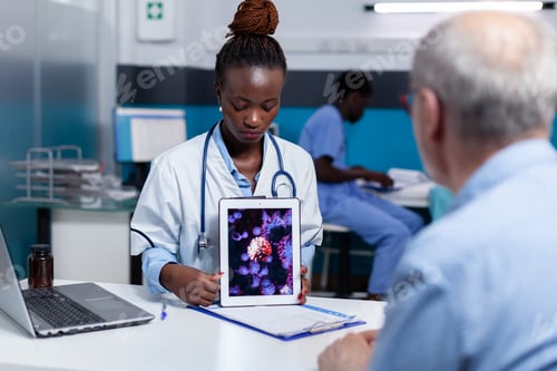 Preview: African american medic holding virus animation on tablet