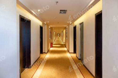 Preview: Hallway straight with the door and golden lighting illuminated in the hotel