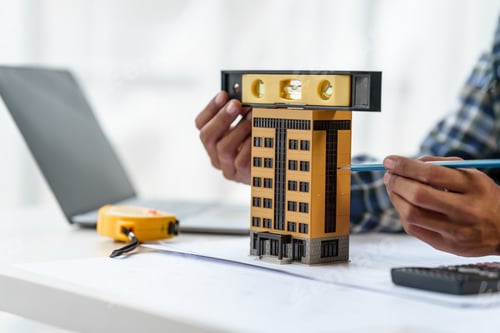 Preview: Architect engineer drawing plan blueprint of condominium or apartment tower building