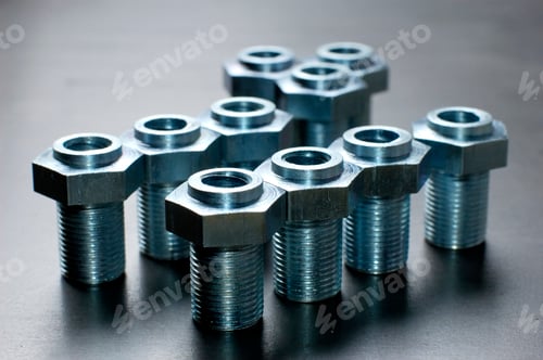 Preview: Close-up of several chrome metal bolts