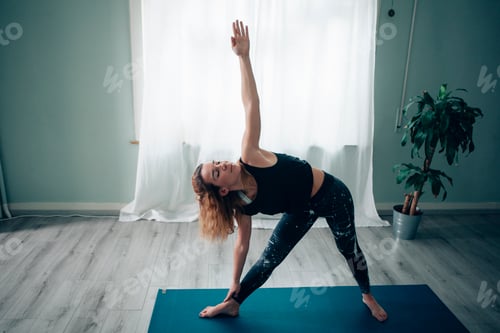 Preview: young yoga teacher doing positions at the yoga school
