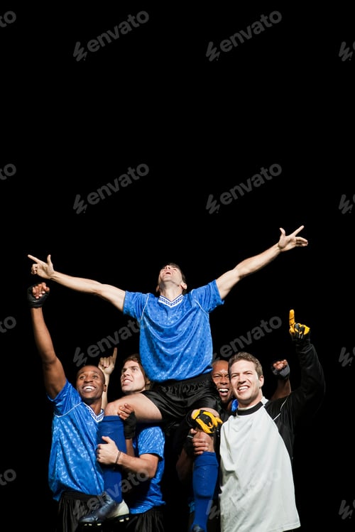Preview: Victorious sports team celebrates their win with sheer joy and raised arms.