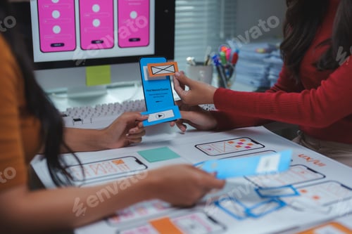 Preview: Ux designers working on user interface and user experience of mobile application