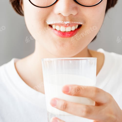 Preview: A woman drinking milk