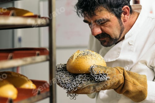 Preview: Baker kneading dough in a bakery.