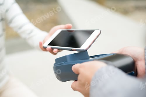 Preview: Customer using mobile phone to pay