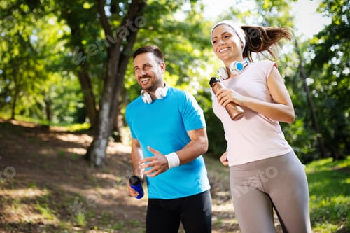 Preview: Young people running outdoors. Couple or friends of runners exercising in park