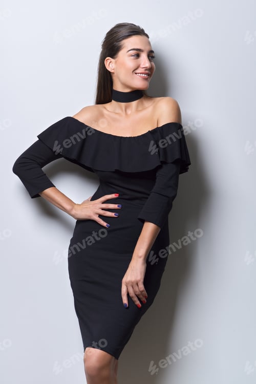 Preview: Beauty fashion portrait of young beautiful woman in small black dress