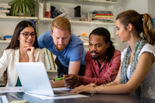 Preview: Group of happy business people working as a team at the office on meeting