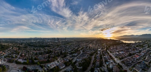Preview: Aerial Panorama of Burnaby at Sunset with Distant Urban Skyline and Blue Sky