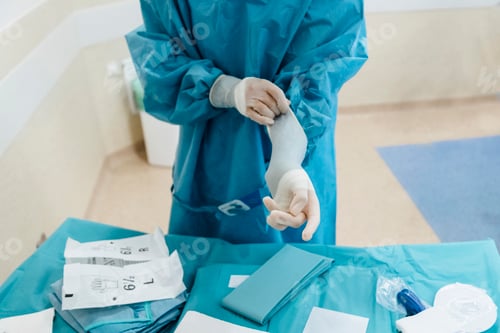 Preview: Surgeon checking wearing gloves before operation