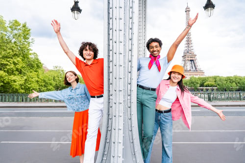 Preview: Group of young happy friends visiting Paris and Eiffel Tower