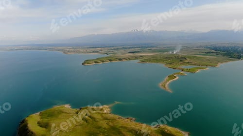Preview: Aerial view of a reservoir with fresh water with the mountains in the background