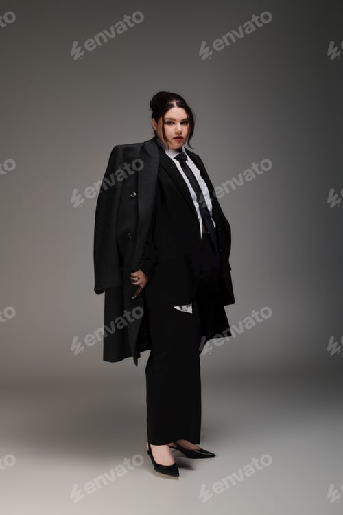 Preview: Elegant and confident plus size woman showcasing modern fashion in a stylish black outfit