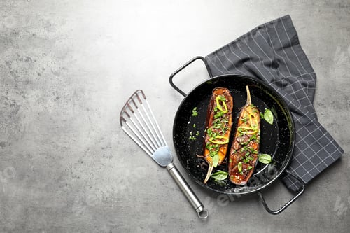 Preview: Frying pan with fried eggplant slices on table, top view. Space for text