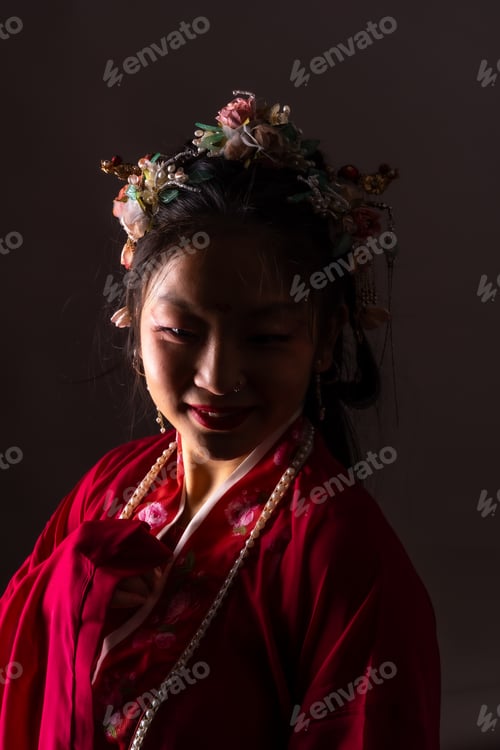 Preview: A woman wearing a red dress and a flowery headband