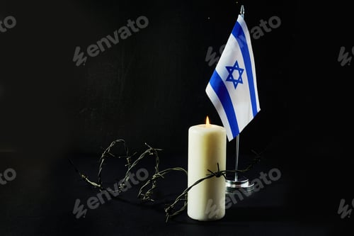 Preview: Flag of Israel, barbed wire and burning candle on black background. Holocaust memory day
