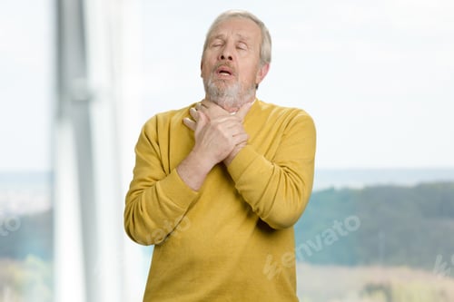 Preview: Portrait of old man with pain in throat.