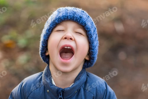 Preview: Cheerful preschool kid outdoors