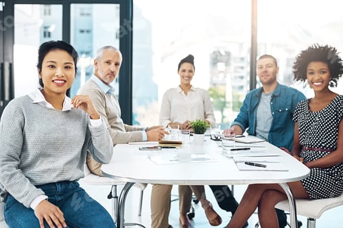 Preview: Great minds think alike. Portrait of a group of colleagues sitting together in a boardroom.