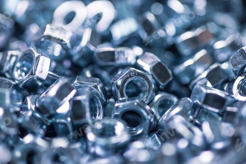 Preview: Metal chrome nuts in a chaotic order industrial background