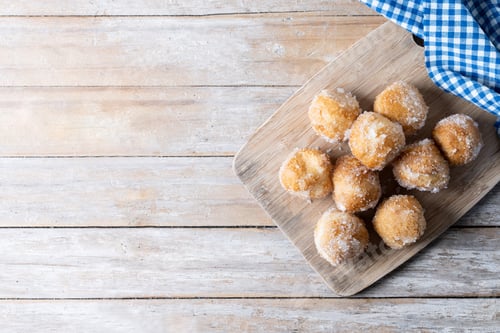 Preview: Delicious Sugar Doughnuts on a Wooden Cutting Board