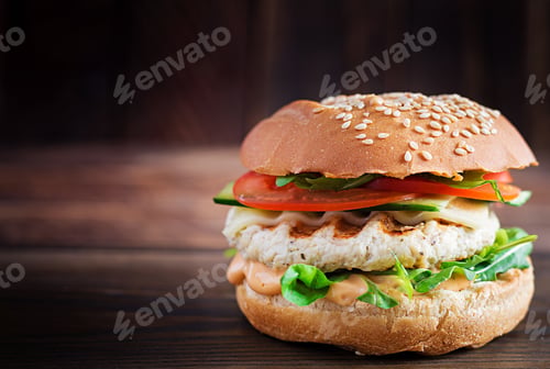 Preview: Big sandwich - hamburger burger with turkey meat, tomato, cucumber and lettuce.