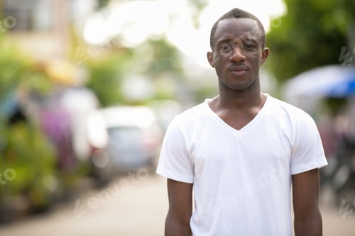 Preview: Young African man in the streets outdoors