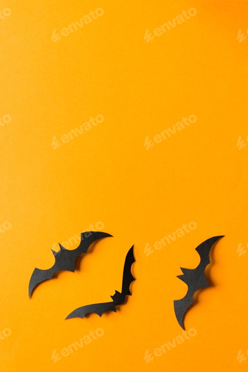 Preview: Halloween decorations, bats on orange background. Halloween party greeting card mockup