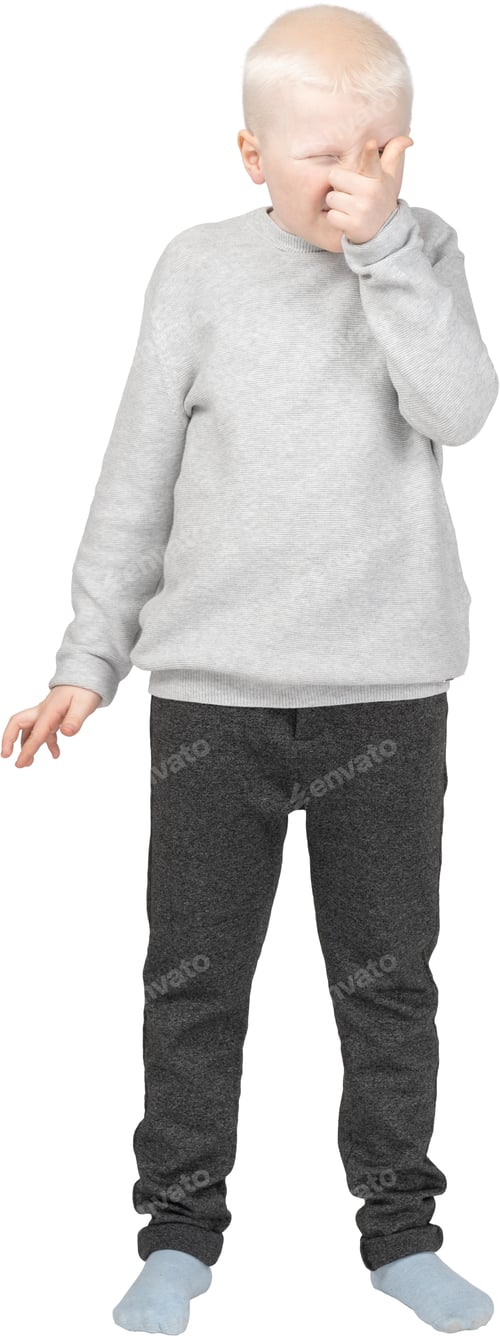 Preview: a young boy wearing a gray sweater and black jeans