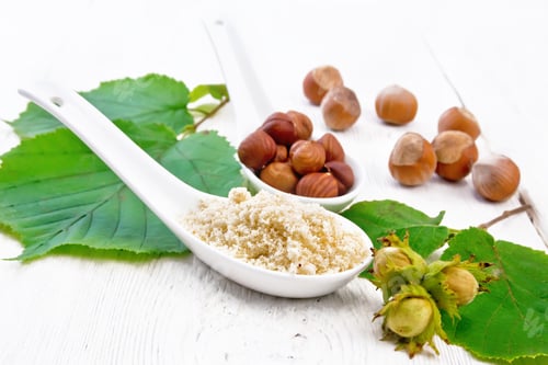 Preview: Flour and hazelnuts in spoons on light board