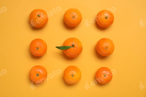Preview: Fresh ripe tangerines on orange background, flat lay