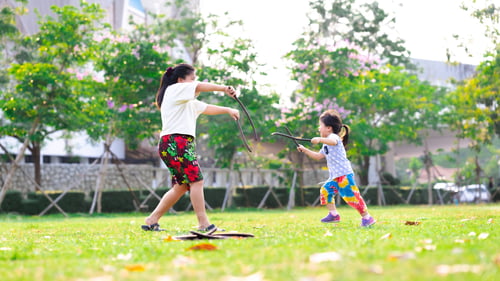 Preview: Mother and daughter were playing in the lawn. Families play fights with fun.