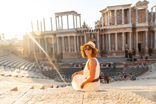 Preview: Roman Ruins of Merida, a young tourist in a dress visiting the Roman Theater. Extremadura, Spain