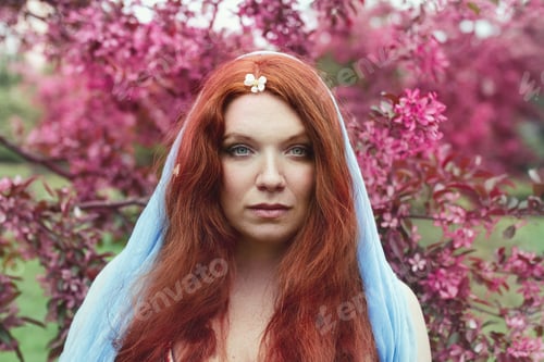 Preview: redhead young woman green eyes and freckles wearing blue cape cherry flower rose cherry blossom