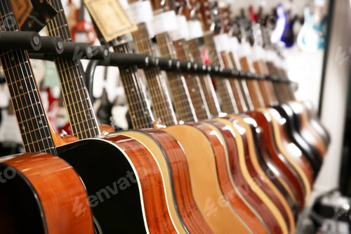 Preview: Row of different guitars in music store, closeup