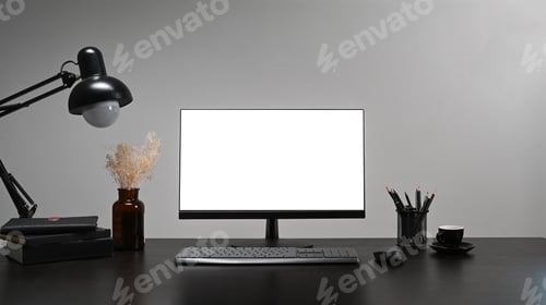 Preview: Computer, coffee cup, pencil holder and lamp on black table at stylish workplace.
