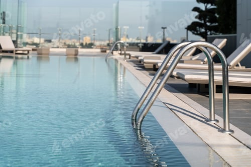 Preview: Large, spacious pool with blue water. Have a good rest by the pool