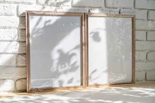 Preview: Photo frames on floor over white brick wall