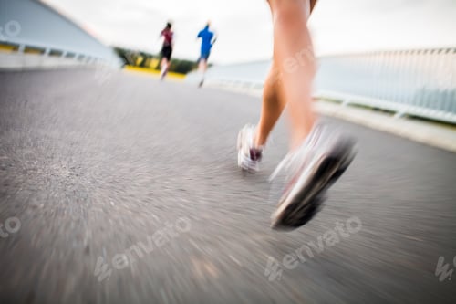 Preview: Young woman jogging outdoors - detail of the