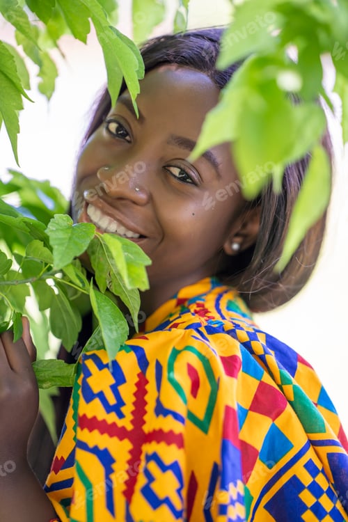 Preview: Close-up of black-skinned woman among the park trees