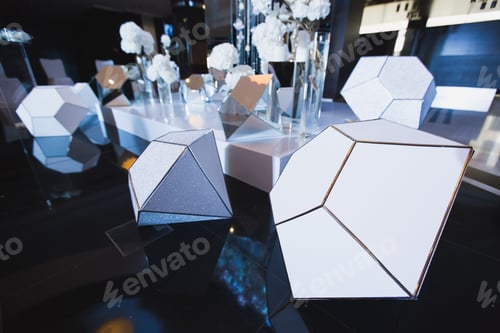 Preview: Geometric Shapes and Floral Arrangement on Table