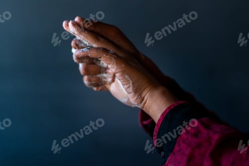Preview: Soaped hands of a person - importance of washing hands during the coronavirus pandemic