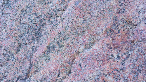 Preview: Texture Of Granite. Granite With Reddish Color. Background From Solid Stone. Pattern With Natural