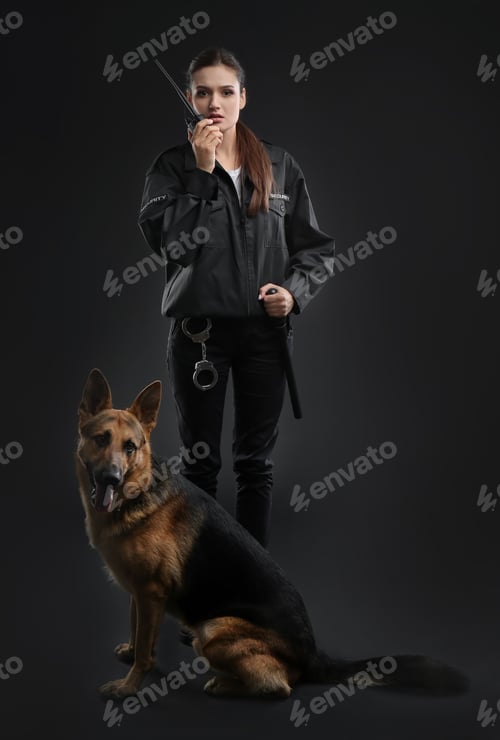 Preview: Female security guard with dog on dark background